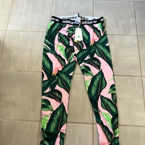 Adidas floral track pants. New with tags. Matches jacket and crop. Size L.